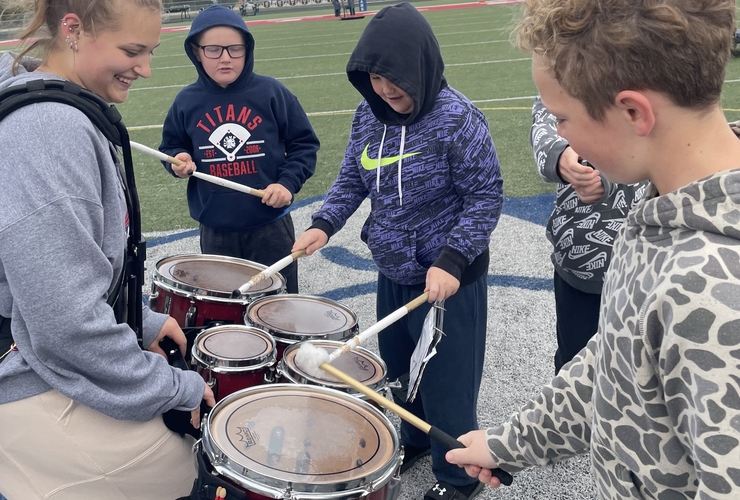 5th grade boys try their hand at the quint-drums