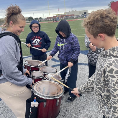 5th grade boys try their hand at the quint-drums